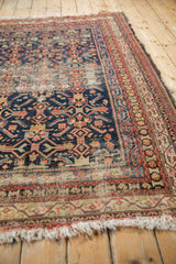 Vintage Malayer rug field with Herati motif, navy, red, ivory, and prominent pile wear.