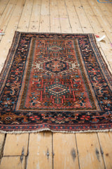 Karaja rug detail: Samovar border and geometric hook and latch field in madder red, navy.