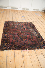 Vintage Lilihan rug runner with plum and teal floral design, visible abrash, and softened edges.