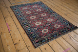 Vintage Lilihan rug border with emerald green, sapphire blue European inspired motifs.