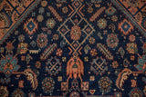 Vintage Malayer rug detail: indigo, dusty blush, sapphire figural and geometric designs.