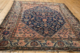 Vintage Malayer rug displaying an allover field of figural motifs and unusual ajar borders.
