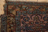 Vintage Mehreban rug corner detail showing hard loss, dusty raspberry field, and sapphire blue border.