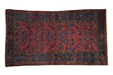 Vintage hand-knotted Mehreban rug, allover pinwheel floral design in raspberry red and sapphire blue.
