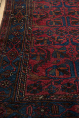 Vintage Mehreban rug border detail, showing sapphire blue and raspberry red serrated leaf motifs.