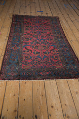 Vintage Mehreban rug end with short fringe and sapphire blue border pattern.