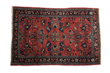 Vintage hand-knotted Lilihan rug, brick red field, quatrefoil medallion, floral palmettes, navy border.