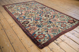 Antique Kurdish Bijar rug, Herati Mahimahi motif, soft beige, blue, blush, and green palette, even wear.