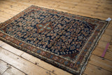 Vintage Dargezine rug corner: navy Herati design, arabesque border, circa 1940s.