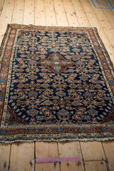 Intricate hand-knotted Herati pattern on vintage Dargezine rug in navy, copper, and powder blue.