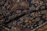 Vintage Dargezine rug pile detail with navy, powder blue, and copper Herati motifs.