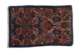 Vintage Mehreban sampler rug with sapphire and indigo blue floral motifs on a dusty rose field.