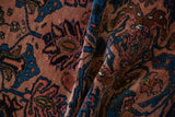 Draped detail of a vintage Mehreban rug's even pile in dusty rose and sapphire blue.