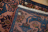 Folded corner of a vintage Mehreban rug showing the intact side cord, fringe, and dense pile.
