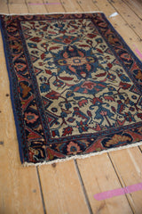 Platinum field with red and blue blossoms, sapphire floral main border, and dark blue side binding.