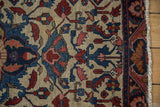 Lilihan rug detail: sapphire blue palmettes, red vinery, platinum field, and floral border.