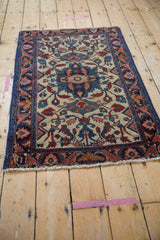 Vintage Lilihan rug with even pile wear, sapphire blue binding, and colorful blossom vinery.