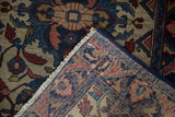 Close-up of vintage Lilihan rug's reverse, showcasing its knotting, fringe, and machine binding.