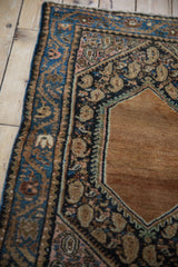 Vintage Hamadan rug detail with sand medallion edge, navy botehs, and a dusty rose vine border.