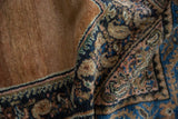 Vintage Persian Hamadan rug pile, showing navy, sand, and dusty rose pattern details.