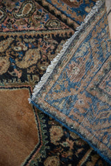Vintage Hamadan rug showing hand-knotted foundation, intact selvage, and muted sand, navy, rose pile.