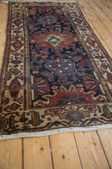 Blue Harshang medallion and copper Herati field on this vintage Hamadan runner.