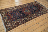 Vintage Hamadan runner showing detailed ivory border, deep copper field with Herati elements, and fringe.