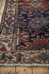 Fringed corner detail of vintage Hamadan runner, ivory border with navy, copper motifs.