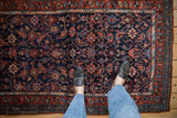 Vintage Kurdish Hamadan close-up, geometric Herati pattern in navy, madder root red, and sky blue.