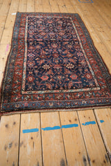 Kurdish Hamadan rug corner, navy and madder red Herati design, minor tatter.