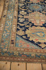Vintage Malayer rug corner detail, highlighting its traditional ornate border and navy field.