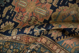 Textured pile of vintage Malayer rug with navy, blush, and sand intricate patterns.