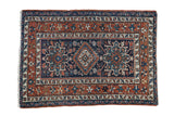 Hand knotted Karaja rug with stepped diamond medallion, geometric animals, navy, copper, ivory.