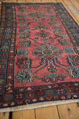 Vintage Lilihan rug section showing pale raspberry red field and large-scale double medallion blossoms.