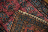 Hand knotted vintage Lilihan rug foundation showcasing geometric patterns and a tattered selvedge.