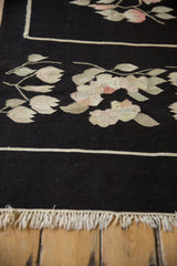 Ivory fringe and thin stripe on the black hand-woven Romanian Kilim runner.