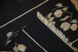 Black hand woven Romanian Kilim runner's flat weave and narrow light stripe.
