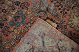 Vintage Sarouk rug shows dusty rose floral pile and detailed hand-knotted foundation pattern.