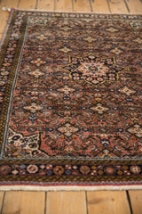Vintage Hamadan rug starburst medallion and Herati design in dusty red, navy, gold.
