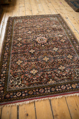 Intricate Herati motif with starburst medallion on this vintage Hamadan rug.