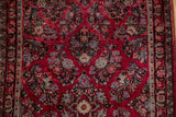 Fine vintage American Sarouk runner detail: cherry red floral spray with navy and charcoal.
