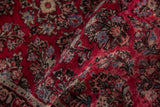 Vintage American Sarouk runner's cherry red pile with blue and charcoal floral spray design.
