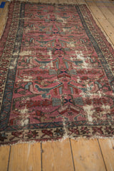 Vintage Persian Mehreban rug detail: dusty plum field, teal arabesques, and wear exposing foundation.