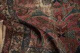 Worn pile of vintage Mehreban rug with dusty plum, teal arabesques, and visible foundation.