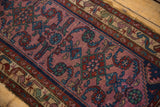 Vintage Mehreban rug detail: pale violet field with floral motifs, jade green, and cobalt blue serpent border.