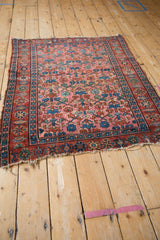 Vintage Lilihan rug corner, raspberry, indigo floral lattice, tattered fringe, missing outer border.