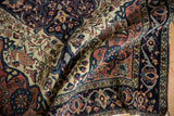 Antique Farahan Sarouk rug main border, featuring colorful palmettes with recessed wool tones.