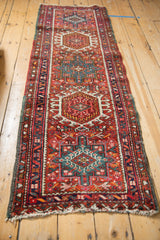 Vintage Karaja runner's central medallion showing hook-and-latch geometric motifs and finned relief.