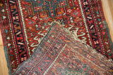 Vintage Karaja runner with cherry red geometric pile and hand-knotted reverse.