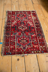 Vintage Karaja rug's triple medallion pattern and geometric floral blossoms on cherry red.
